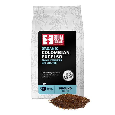 front of Organic Colombian Excelso medium roast coffee bag with pile of ground coffee