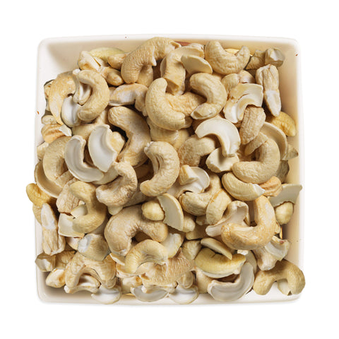 white square bowl filled with whole cashew nuts