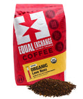 Organic Love Buzz Ground Coffee bag with a pile of ground coffee