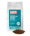 front of Organic Grown by Women Blend coffee bag with pile of ground coffee