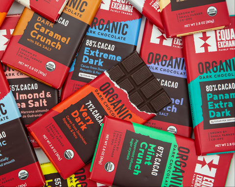 Assorted Equal Exchange organic chocolate bars on a white background
