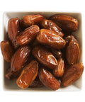 white square bowl filled with dates