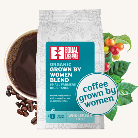 bag of Equal Exchange Organic Grown By Women Blend with roasted coffee beans, brewed coffee, and coffee cherries with leaves in the background